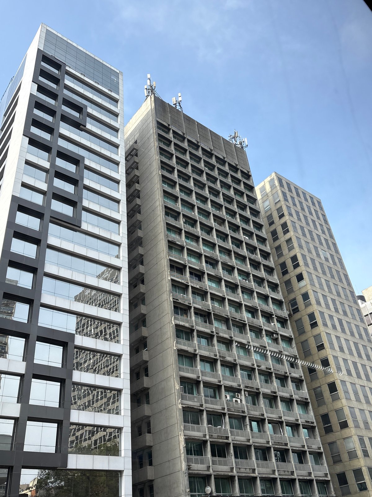 Street-level São Paulo: skyscrapers, overpasses, and federal courts