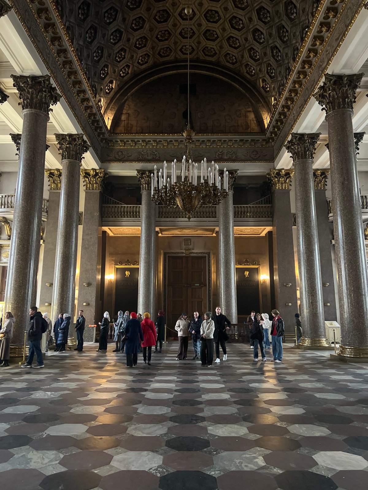 Tourists visit ornate Saint Isaac's Cathedral in Saint Petersburg