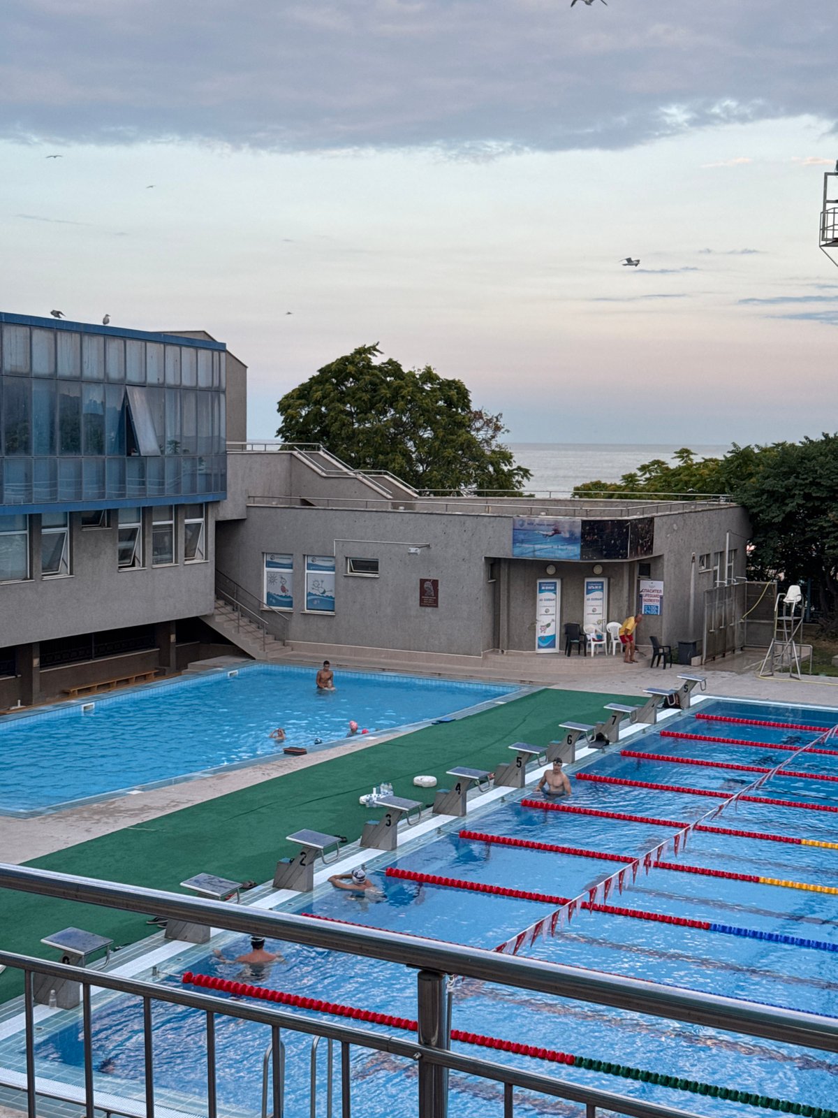 Varna summer evening: pools, a fairground, and dragon sculptures