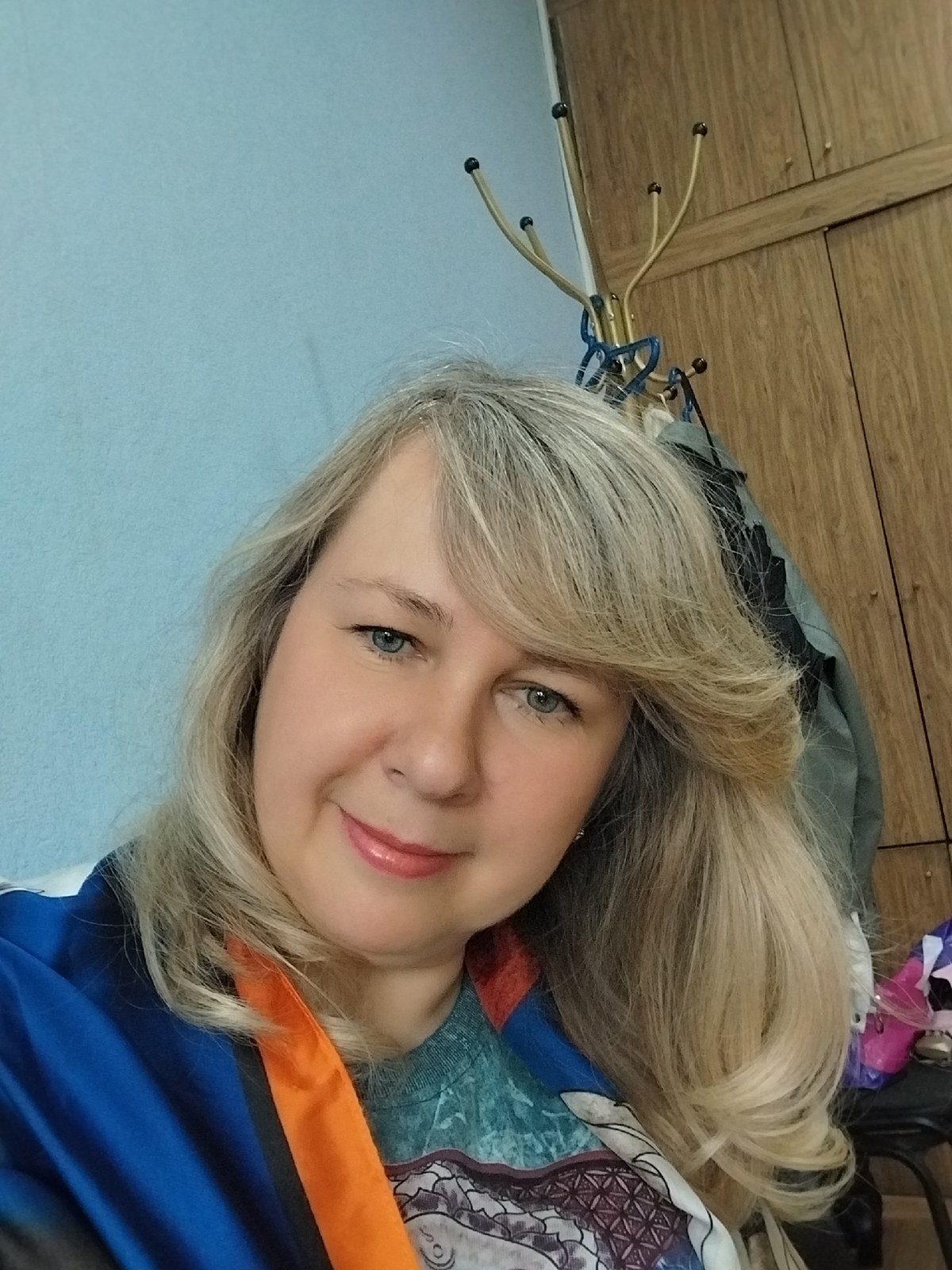 Woman takes selfies indoors in Orenburg, Russia