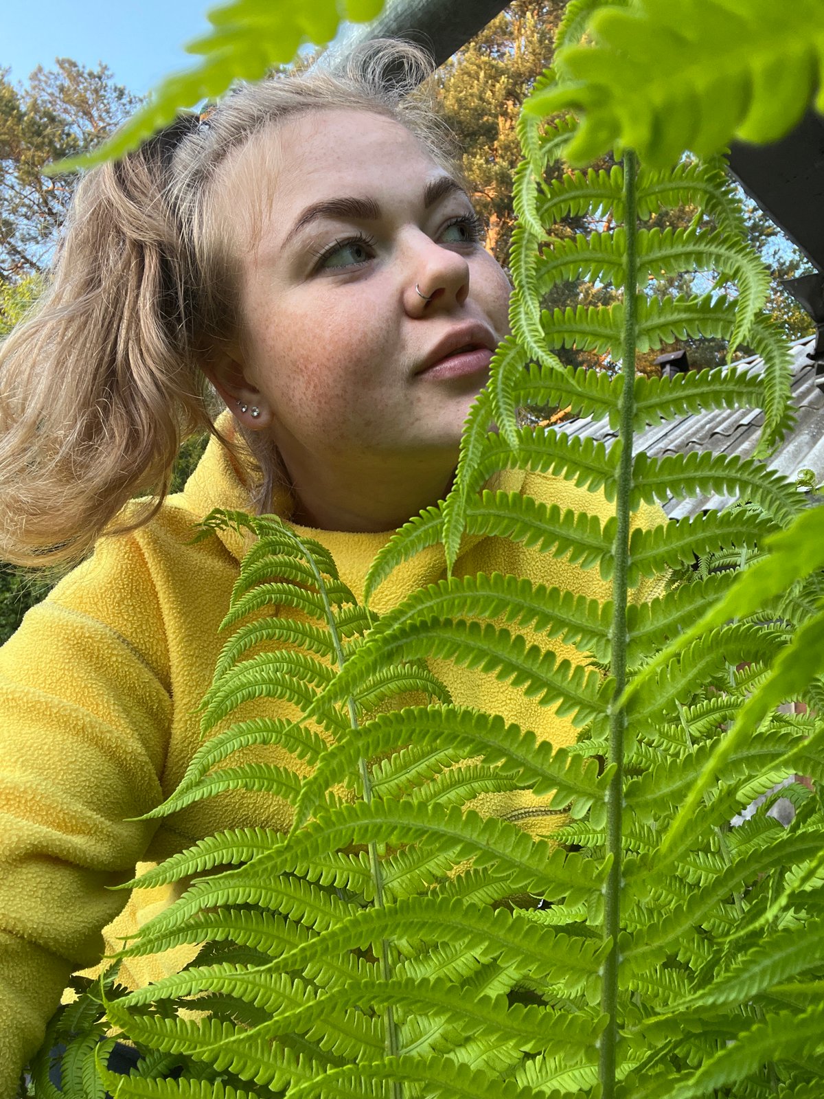 Young woman photographed in green foliage, Chaikovsky Russia