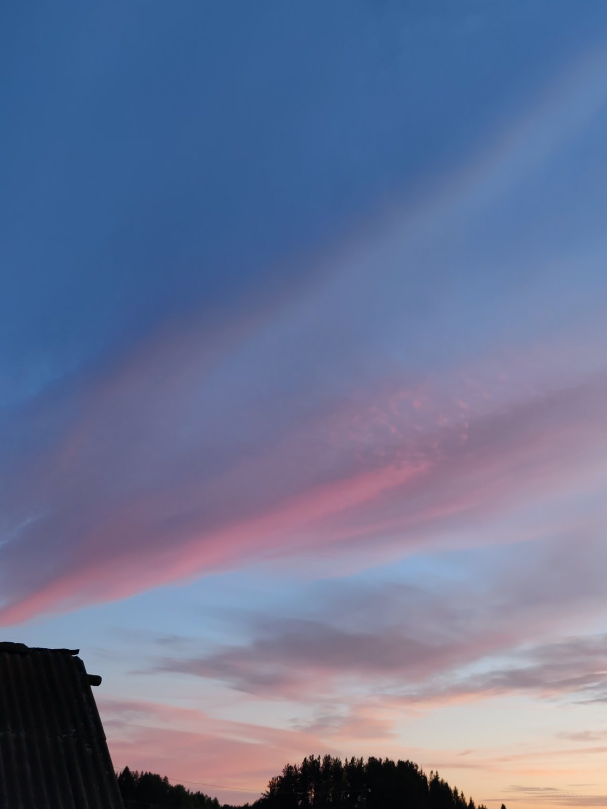 Dusk sky over rural Chukhlem, crescent moon and pastel clouds