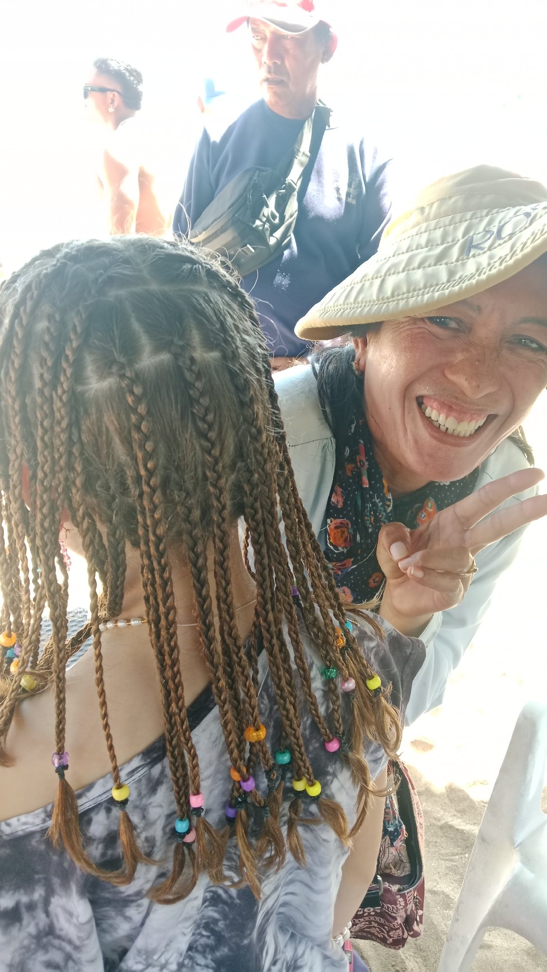 Sunny beach day: surfers, crowds, and candid moments