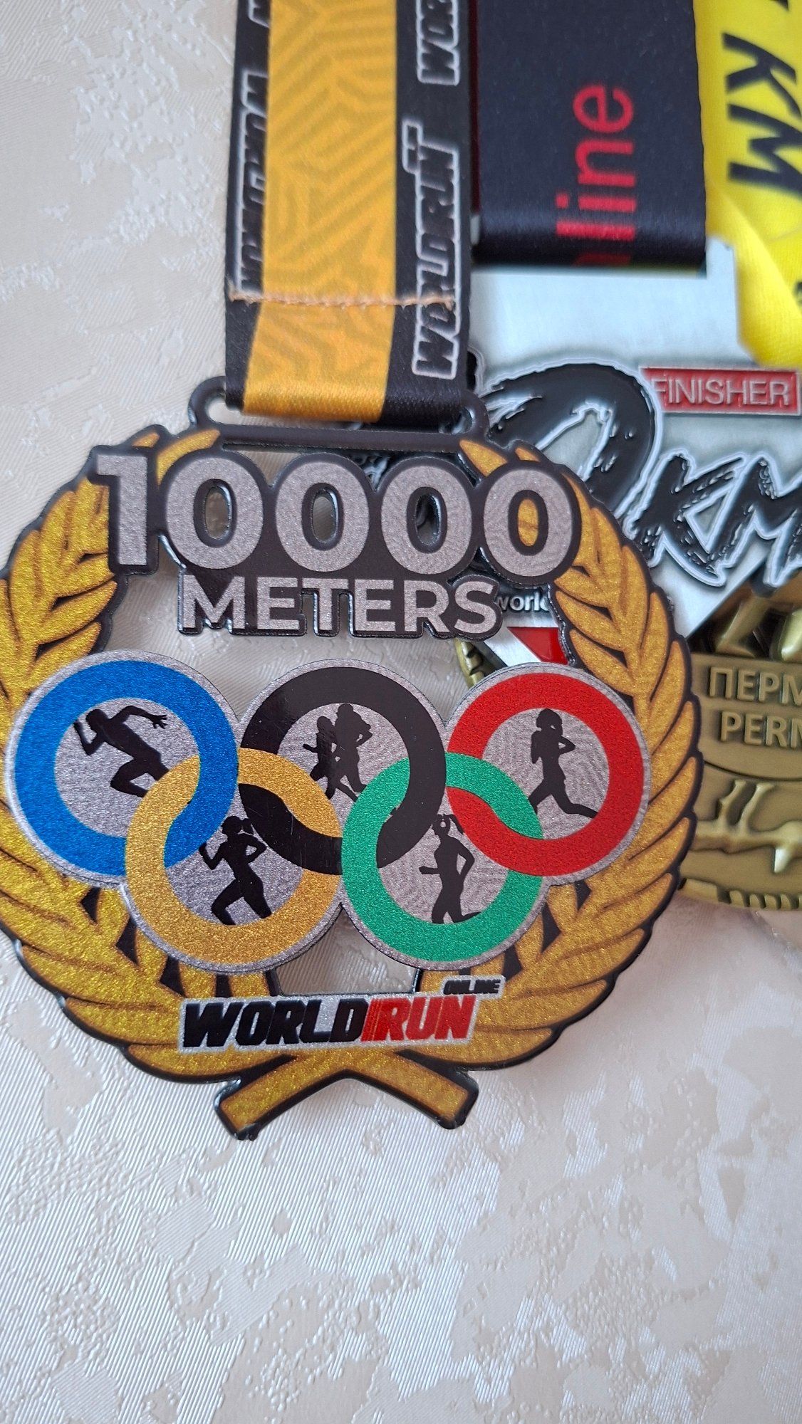 Runner displays medals, relaxes at home in Chaikovsky, Russia