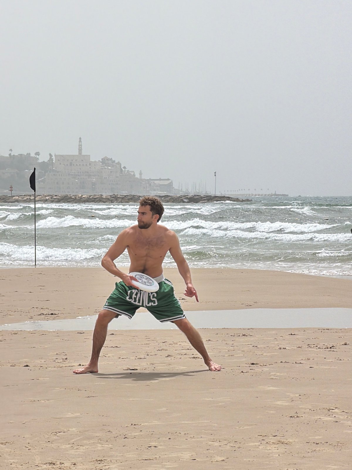 Man in Celtics shorts spotted on Tel Aviv beach