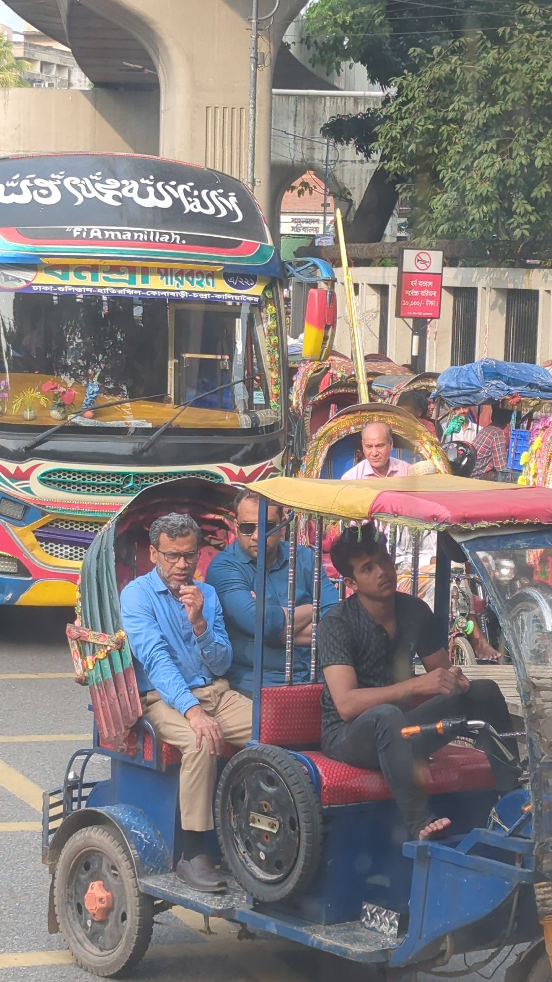 Rush hour traffic and street activity captured across Dhaka