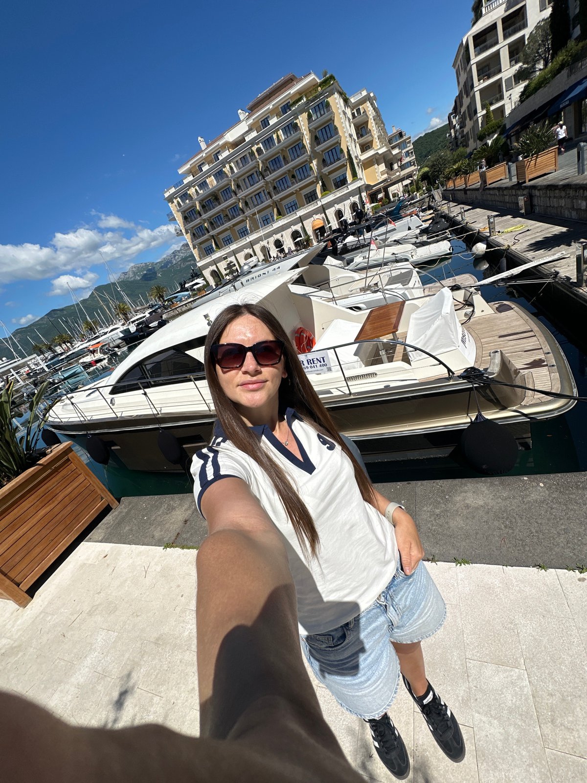 Couple documents leisurely morning at Montenegro's Porto Marina
