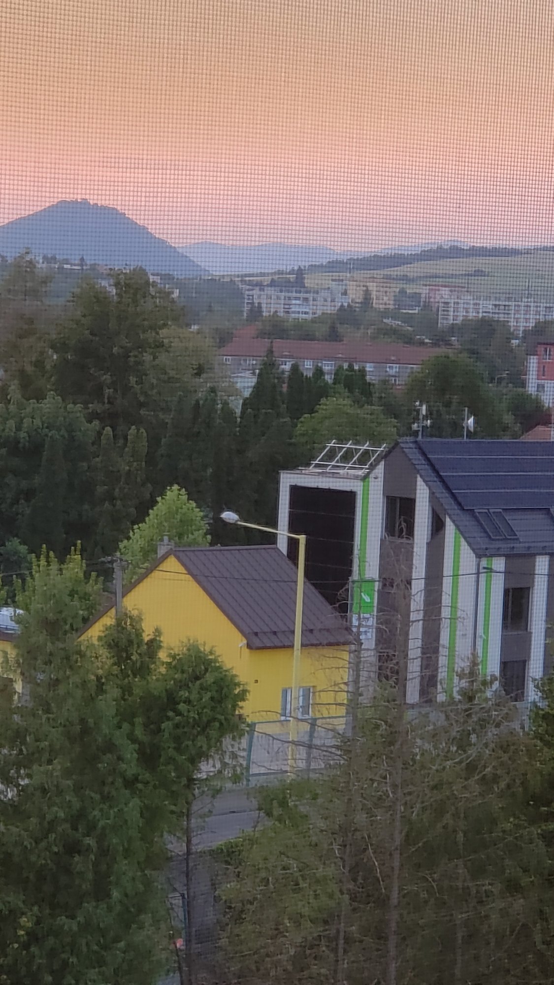 Evening views across Prešov rooftops, hills, and neighborhoods