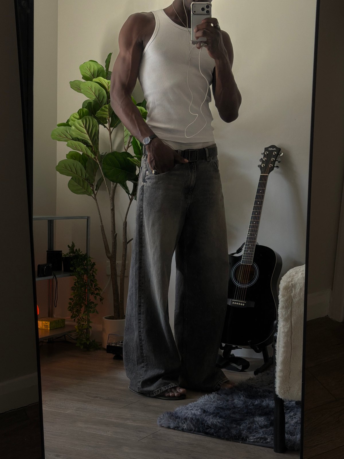 Mirror selfie showing a full outfit in a London room
