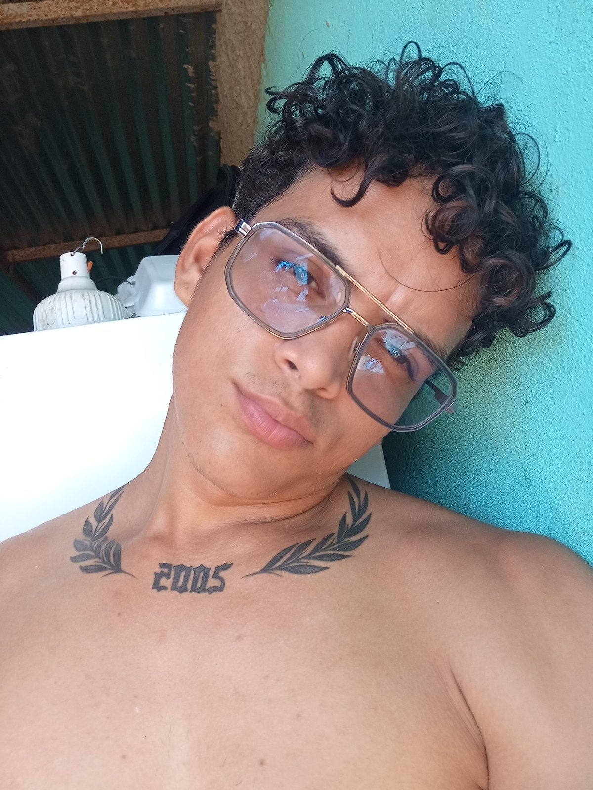 Young man takes selfies with white roses in Venezuela