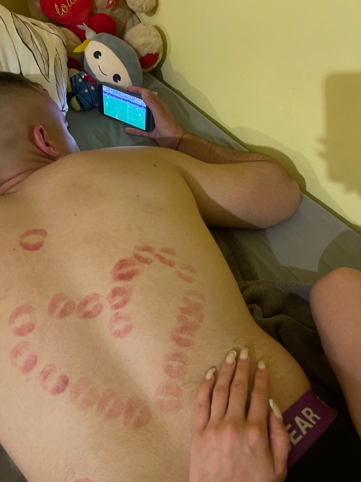 Lipstick kiss marks on back plus hamster in cage