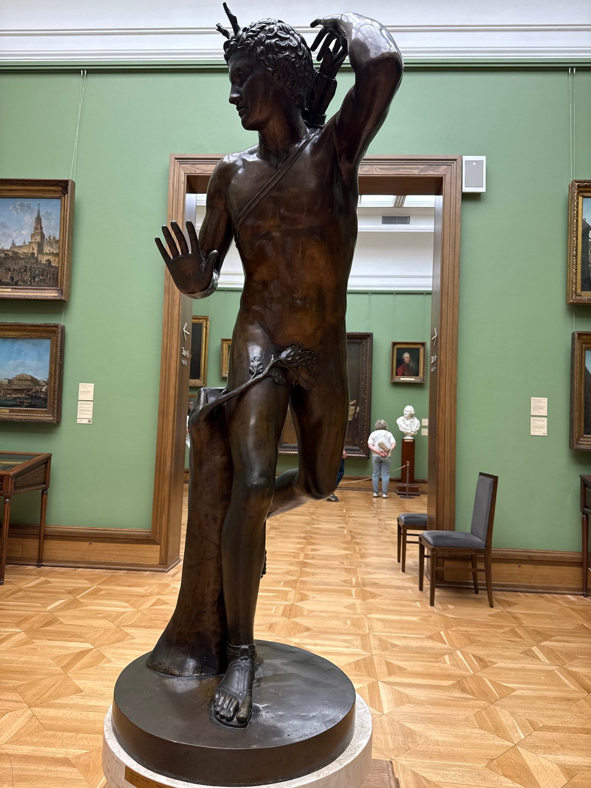 Moscow museum visitor documents artworks and exhibits during morning tour