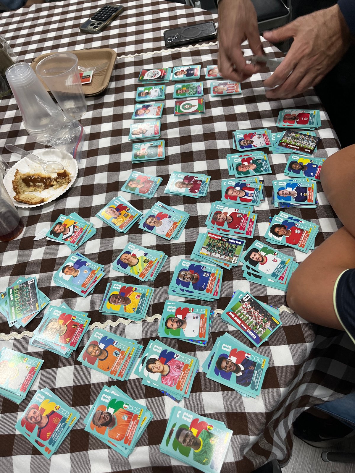 Friends gather for FIFA World Cup sticker trading session