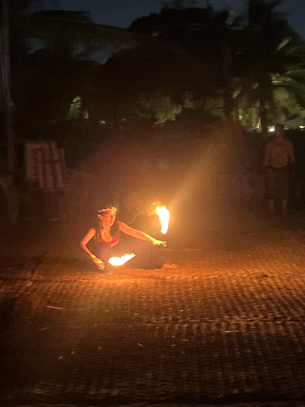 Fire dancers and a DJ light up a Đà Nẵng beach night