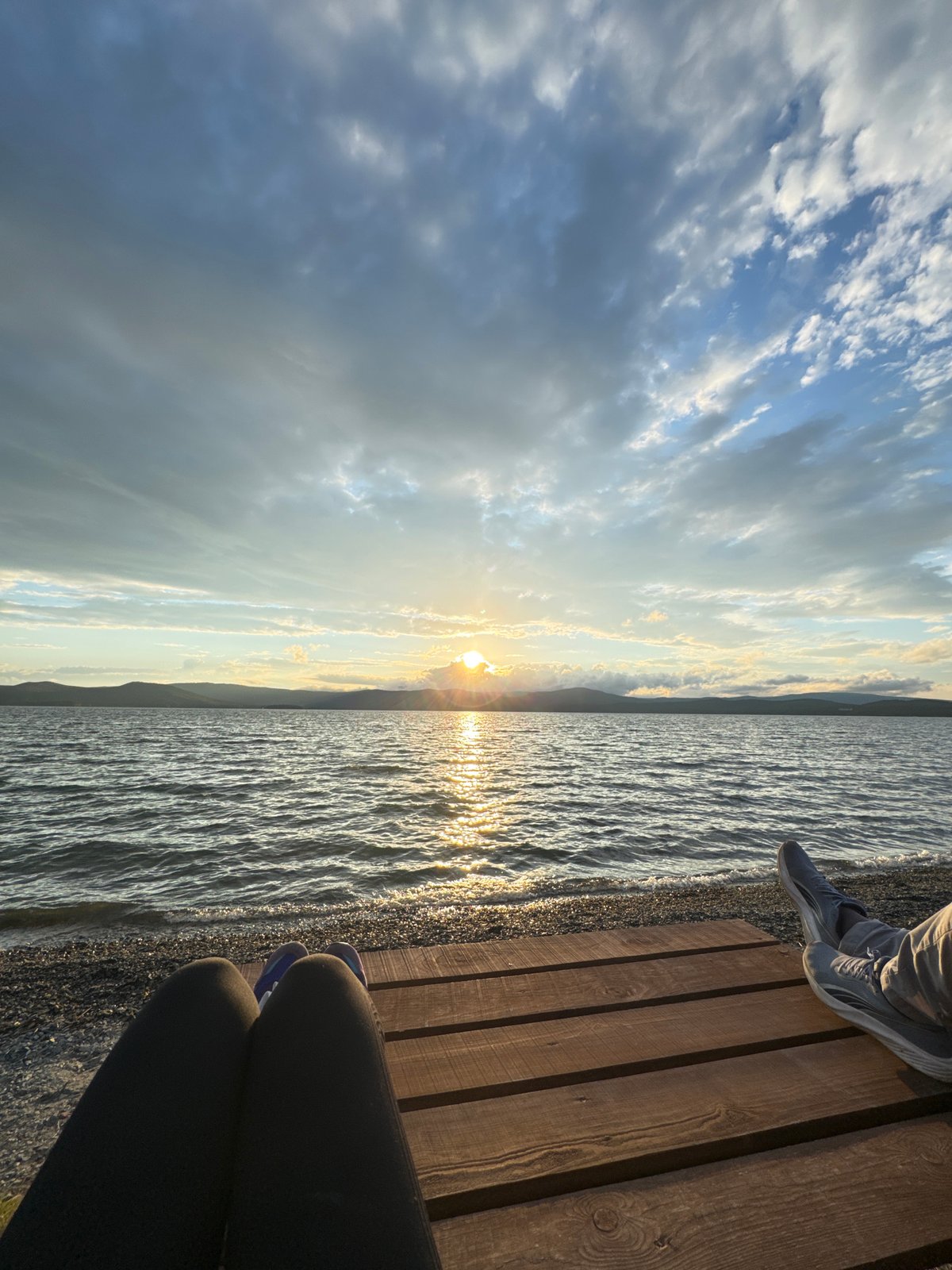 Sunset evening at Lake Turgoyak's shore and pier