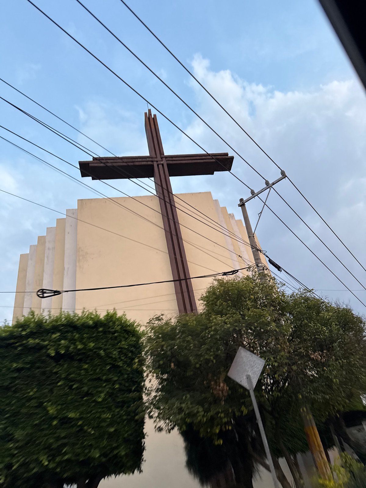 Religious building with metal cross photographed in Puebla, Mexico