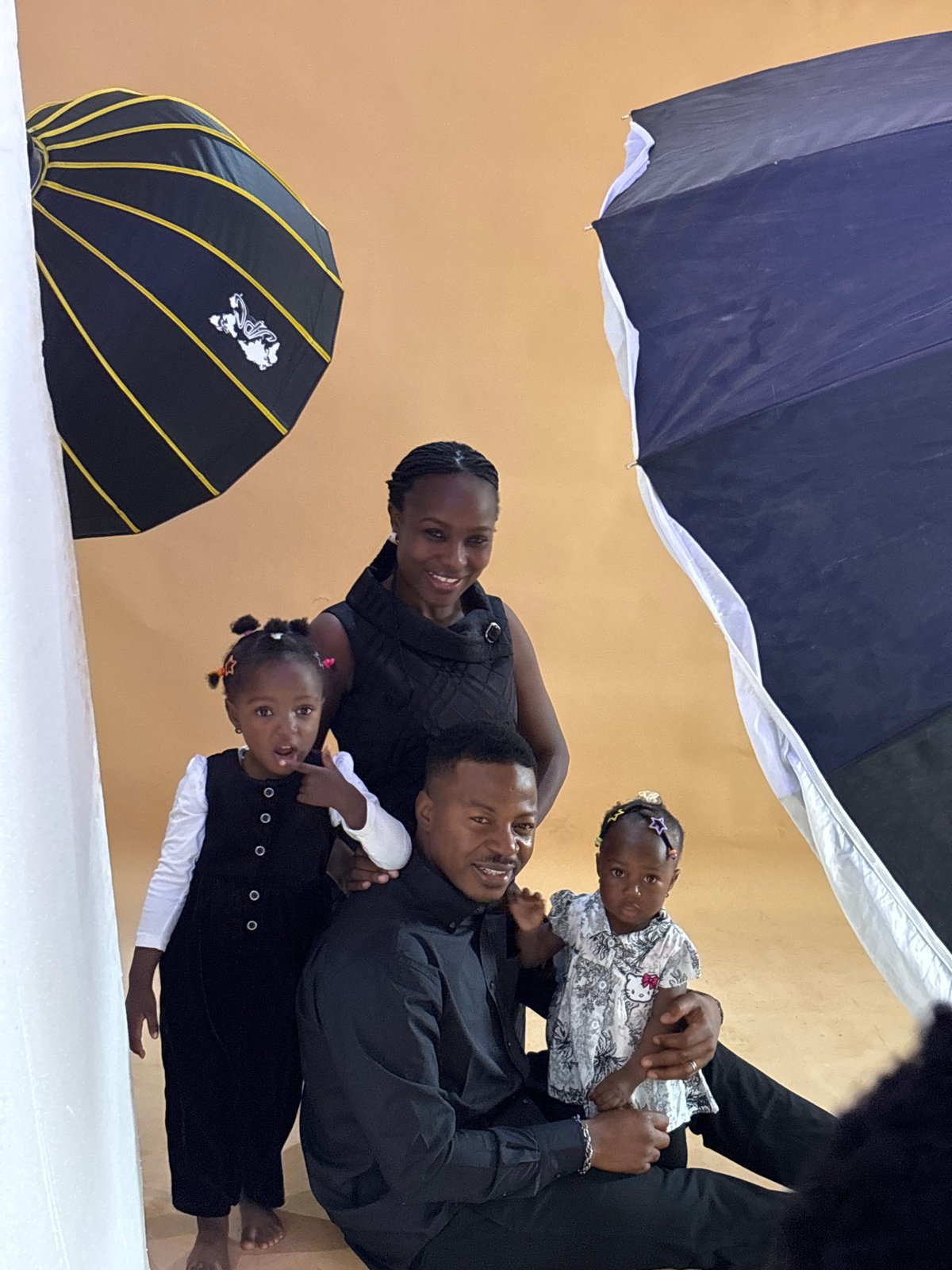 Family studio portraits and rainy streets in Jos, Nigeria