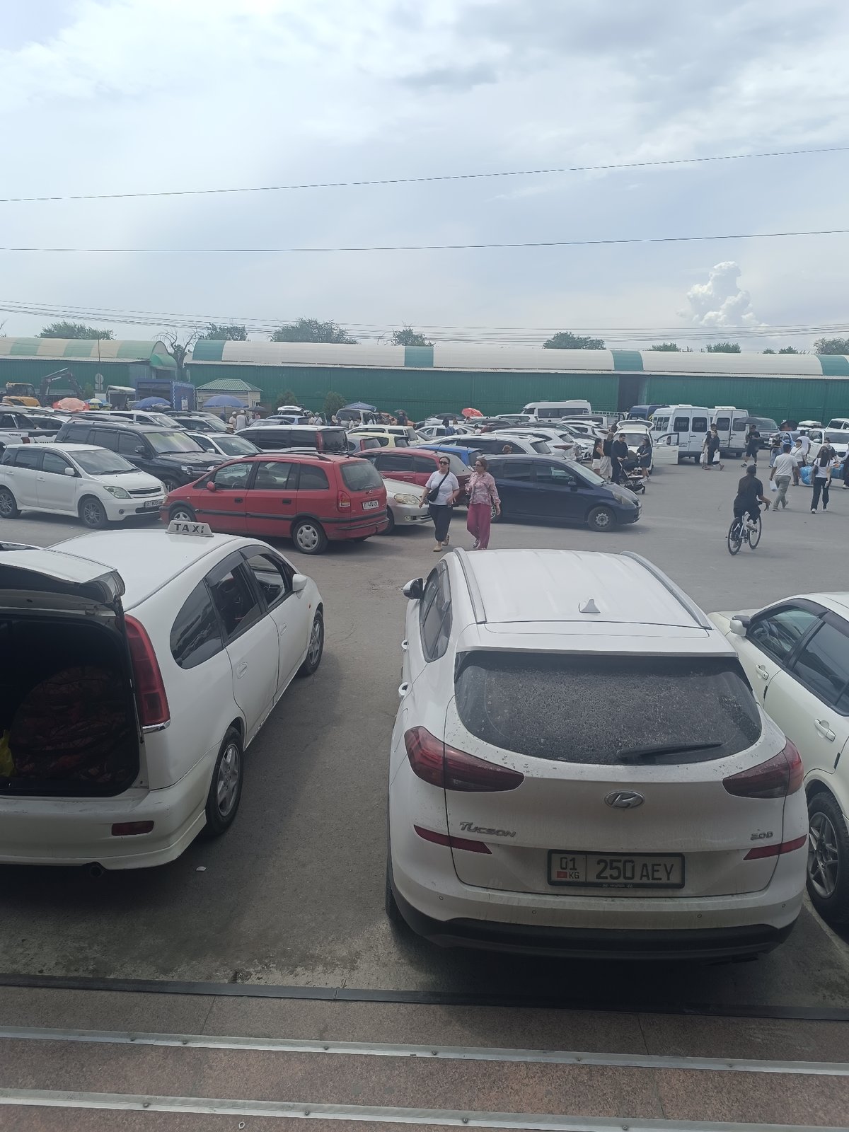 Busy urban morning: street work, market activity, and vehicles