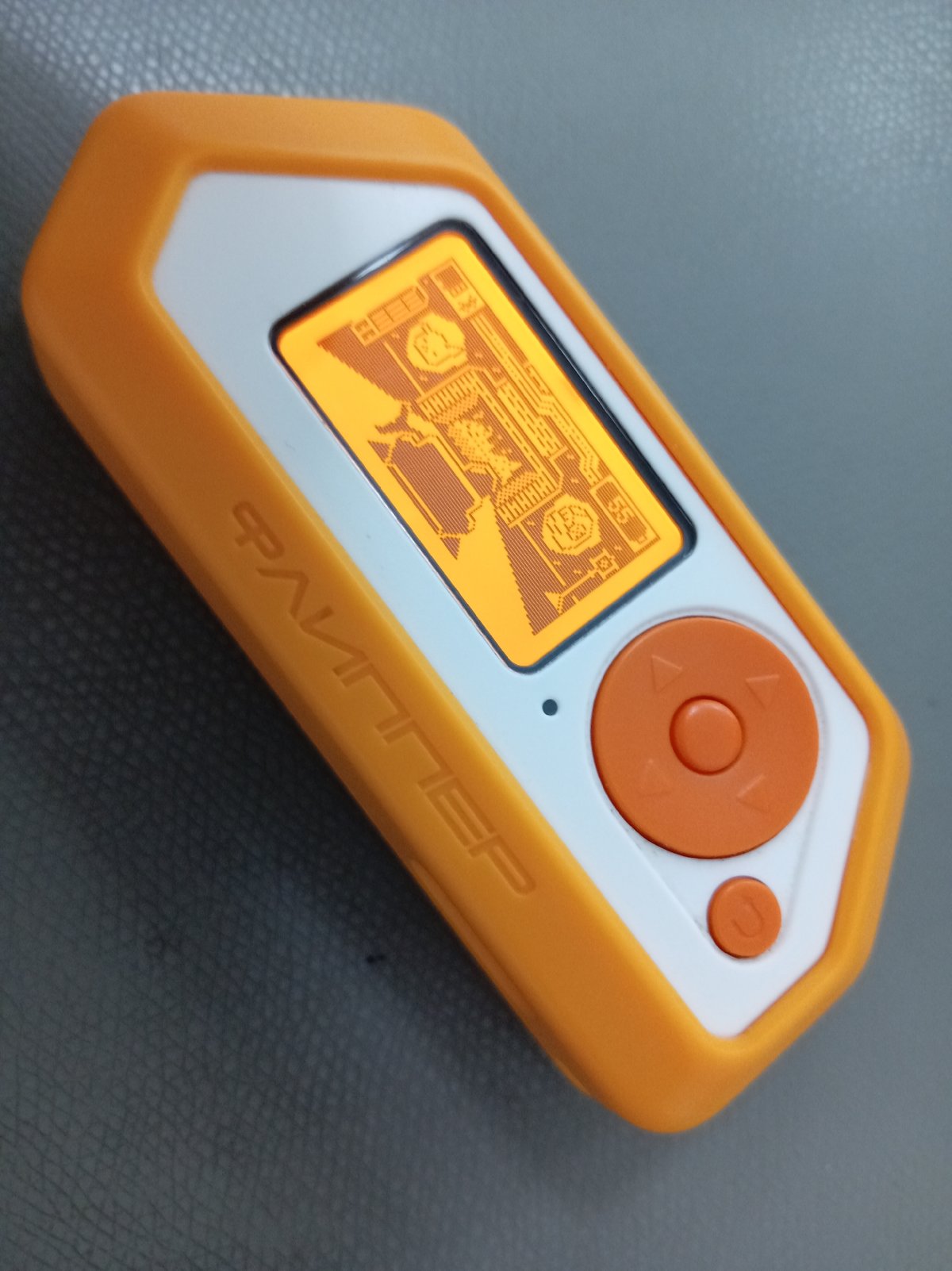 Person operates orange electronic device showing flight tracking data