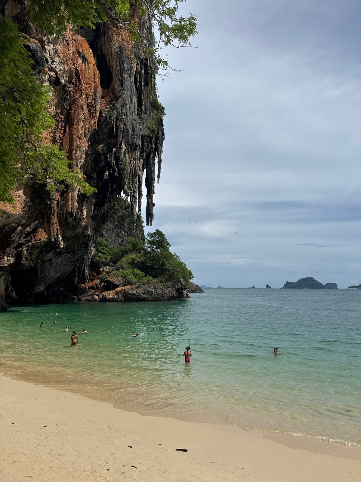 Caves, karst cliffs, and calm waters around Railay Beach, Krabi