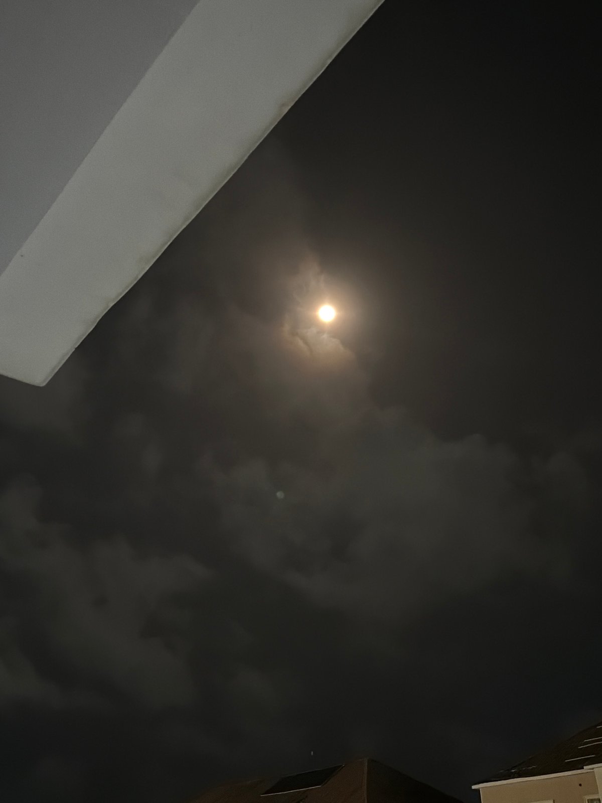 Bright moon partially obscured by clouds observed in Nigeria