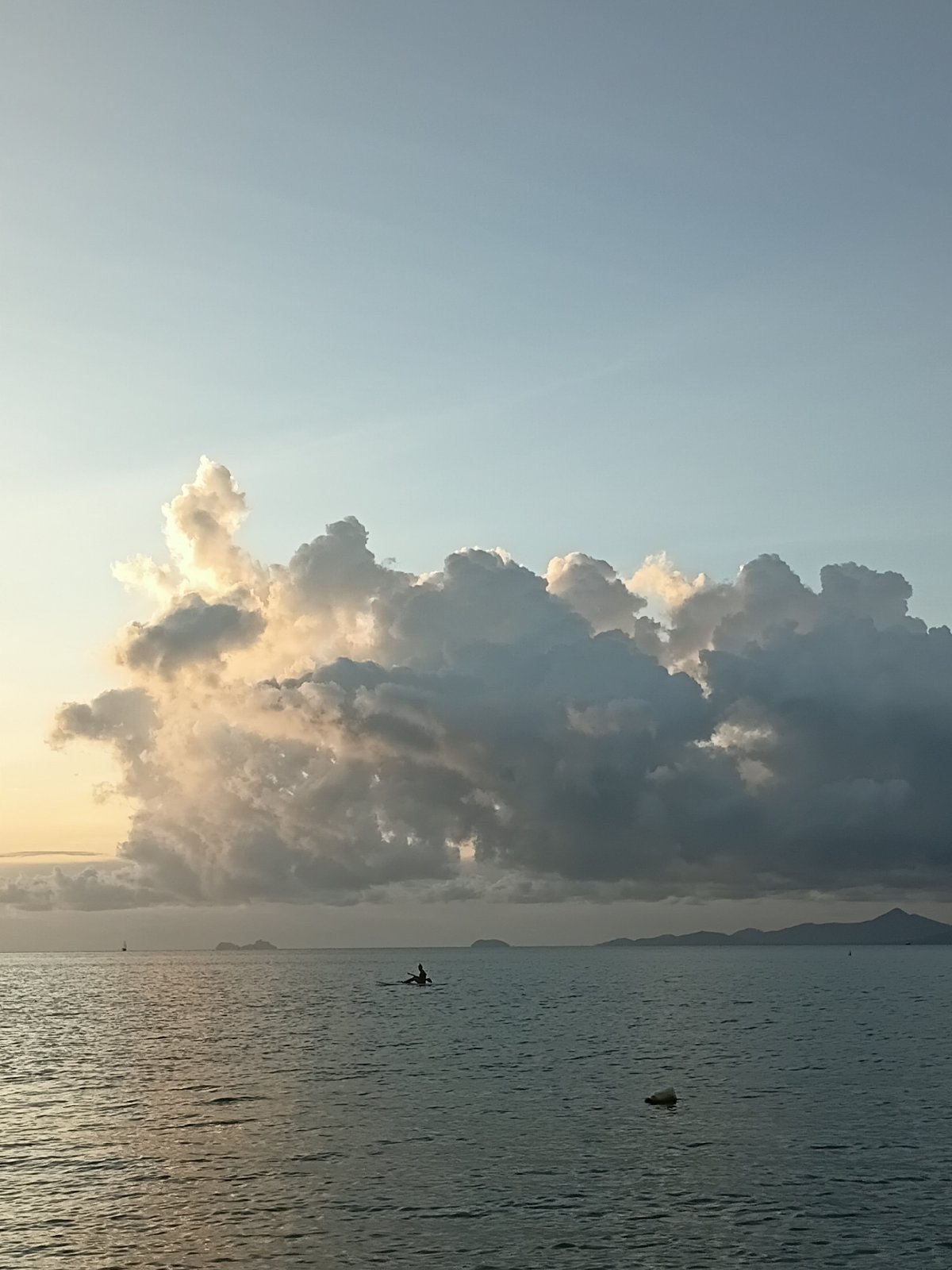Golden hour at Baan Bang Rak — coast, clouds, and calm water