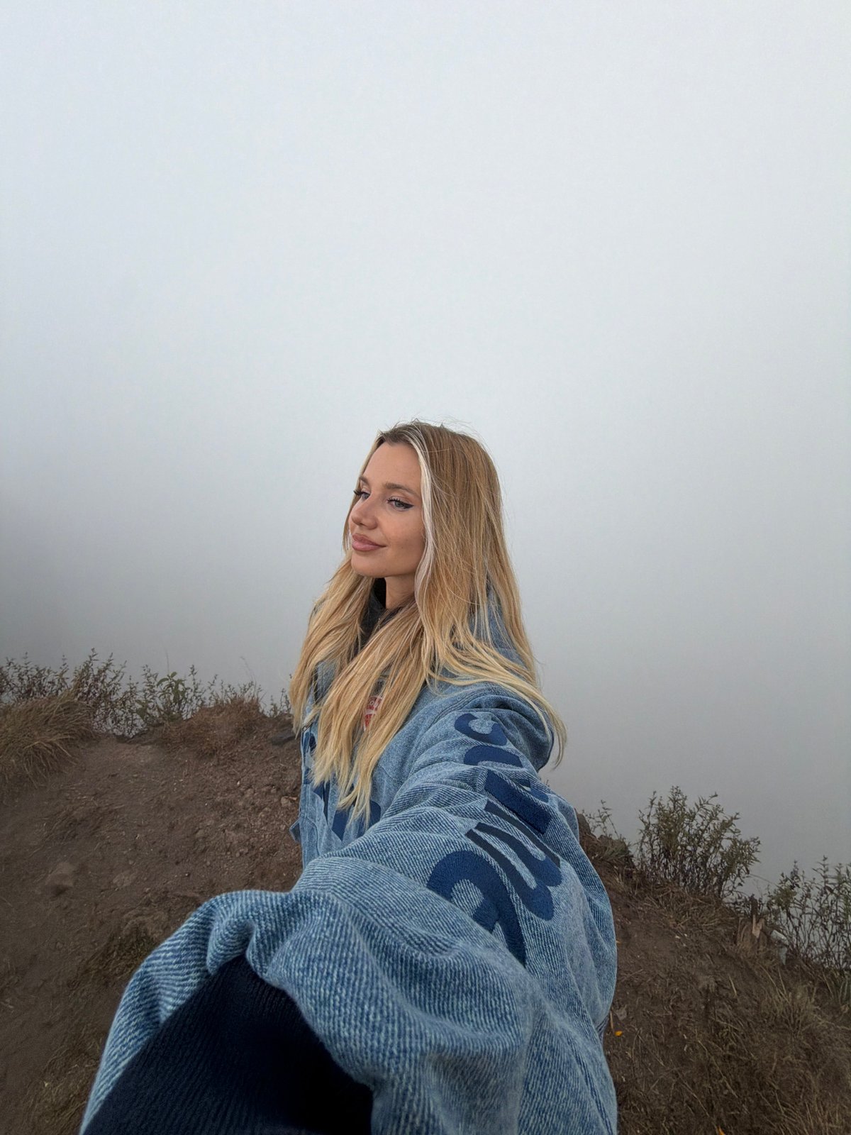 Sunrise selfies at Kintamani volcano in misty morning light