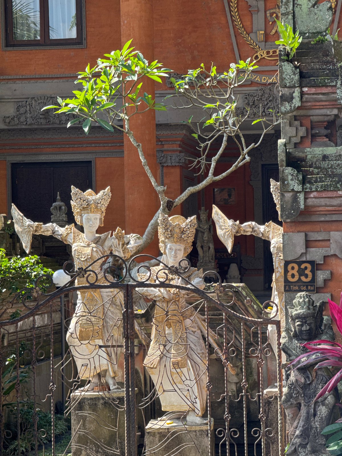 Deep inside Ubud's temple grounds, stone gods and banyan roots