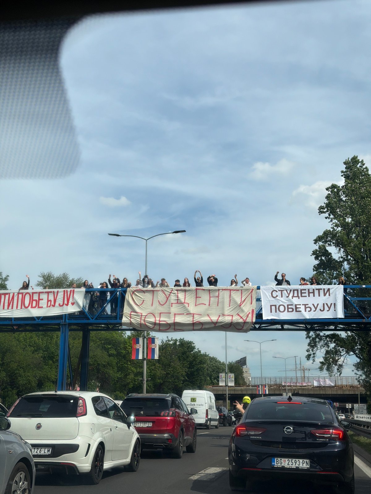 Student victory banners displayed over Belgrade traffic jam
