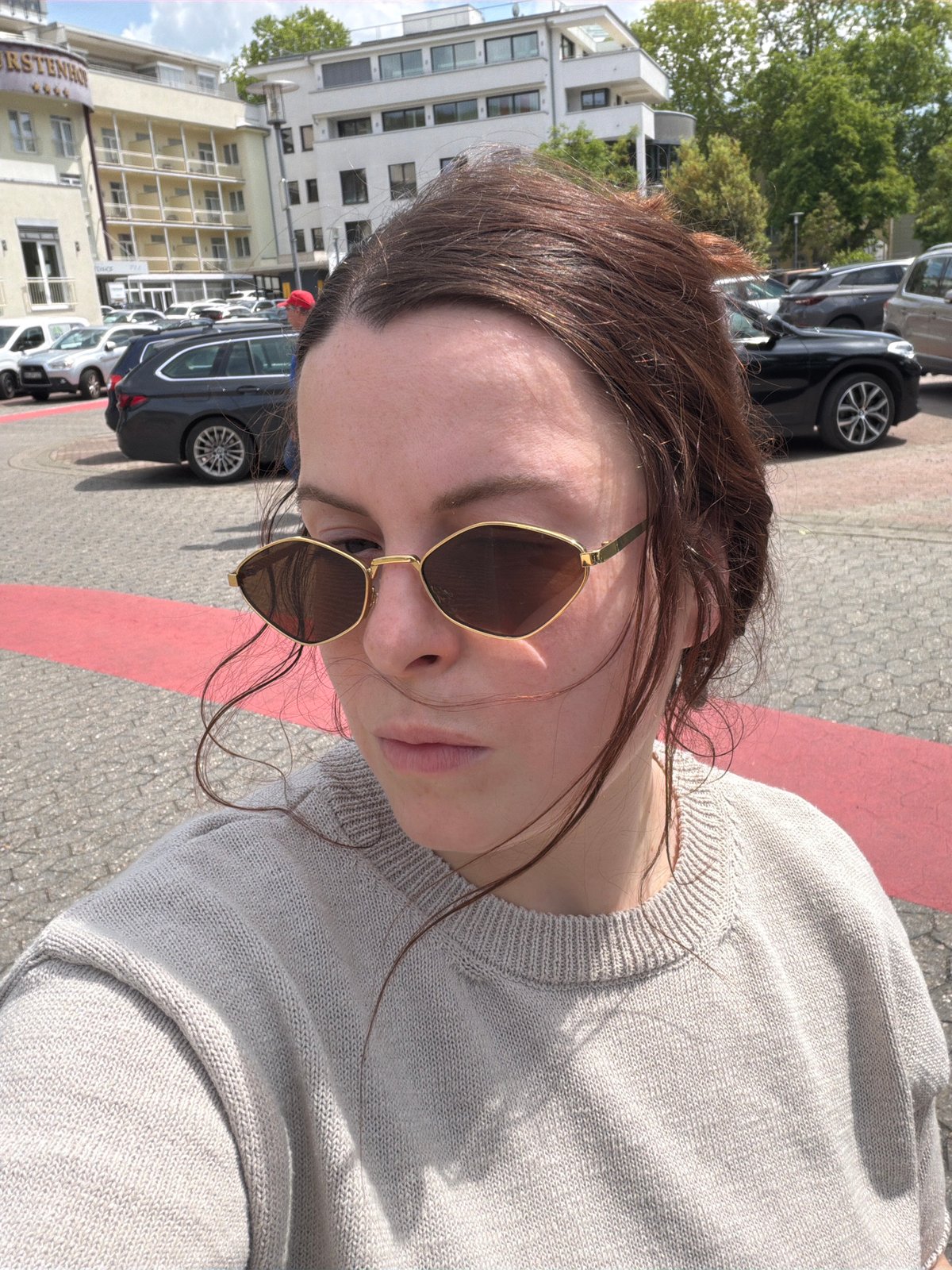 Woman takes selfie in Bad Kreuznach parking area