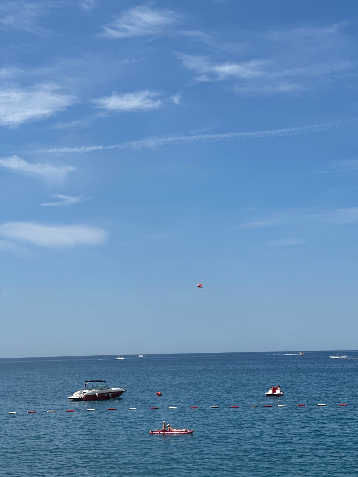 Calm blue sea and buoy line on a clear day in Boreti