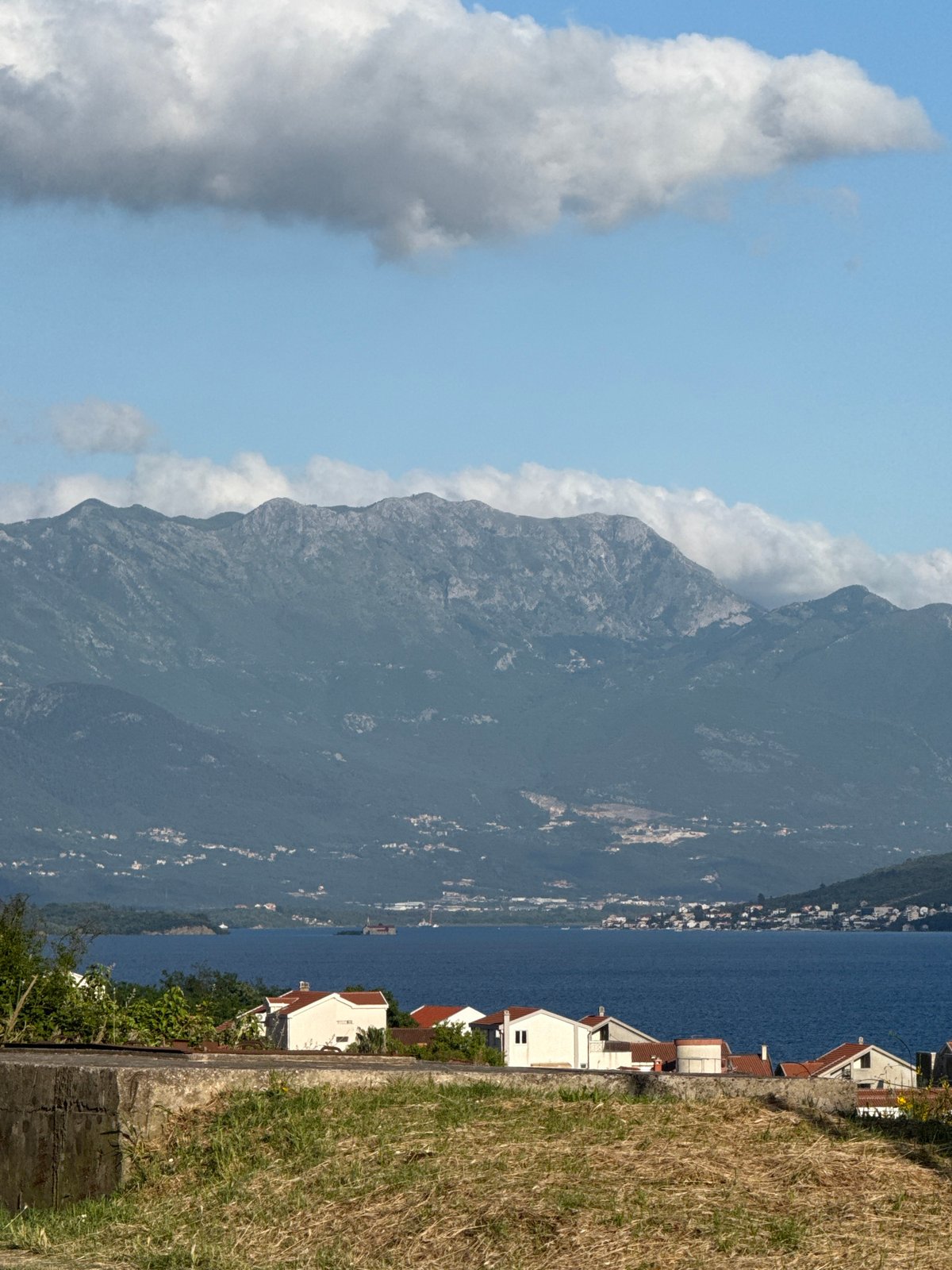 Mountain peak shrouded in clouds observed along Montenegro coast