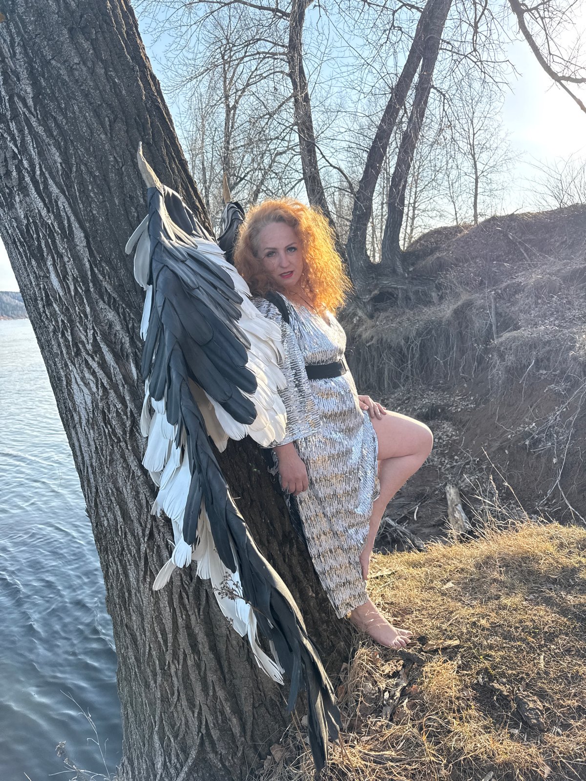 Woman in wings and silver dress spotted in Chaikovsky woods