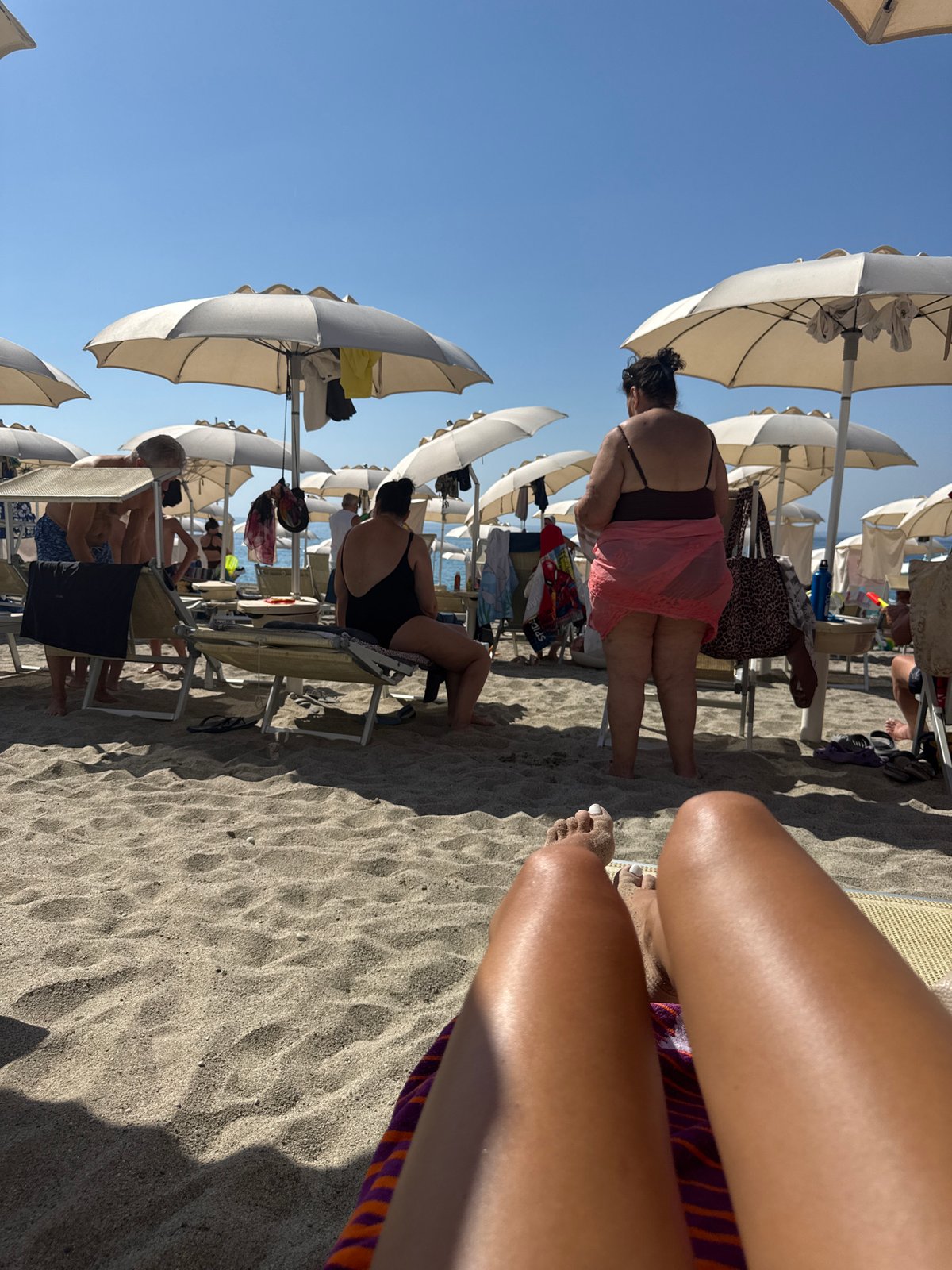 Slow beach morning in Finale Ligure, sunscreen and all