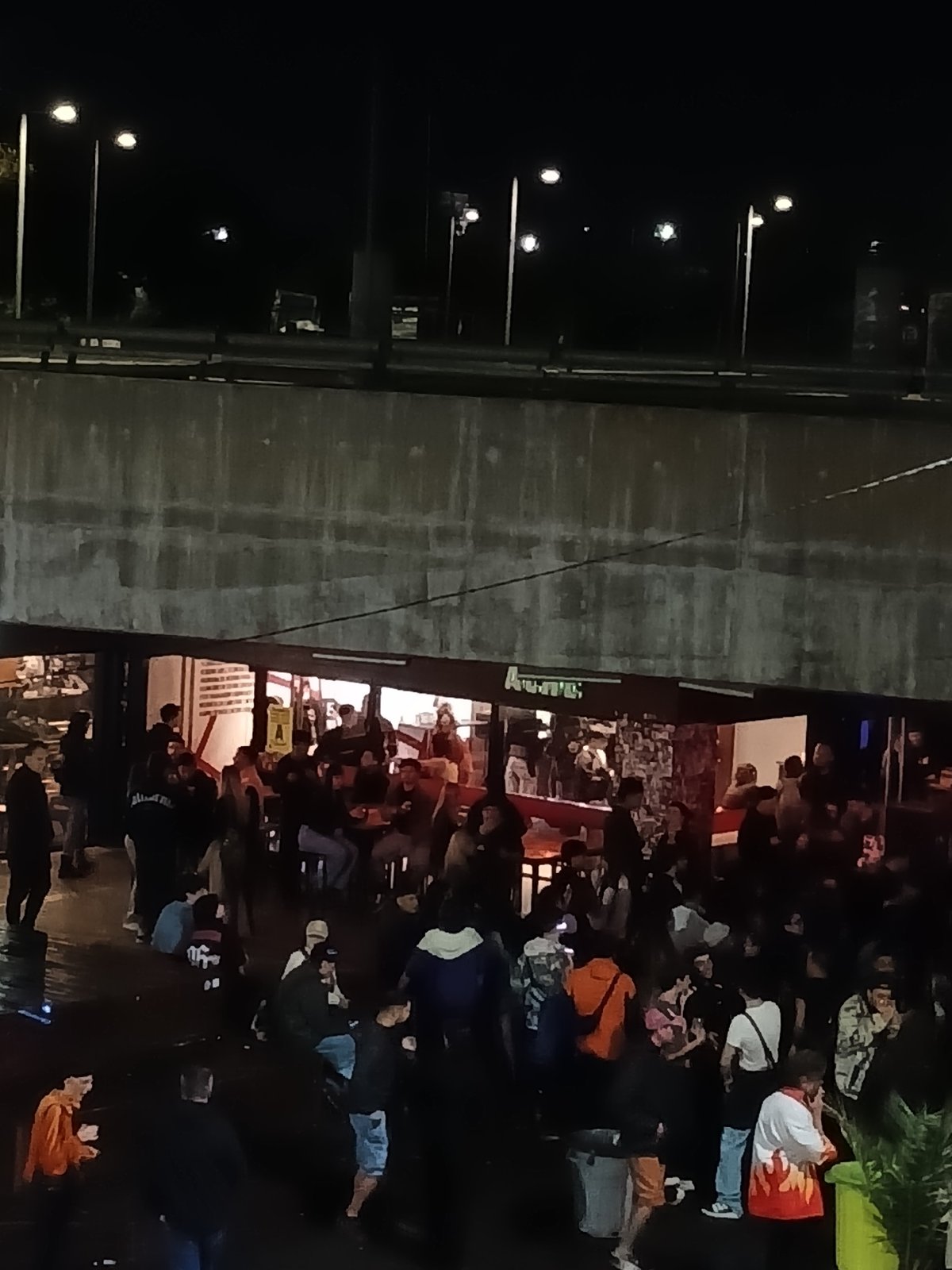 Late-night social gathering documented in Buenos Aires Puerto Madero district
