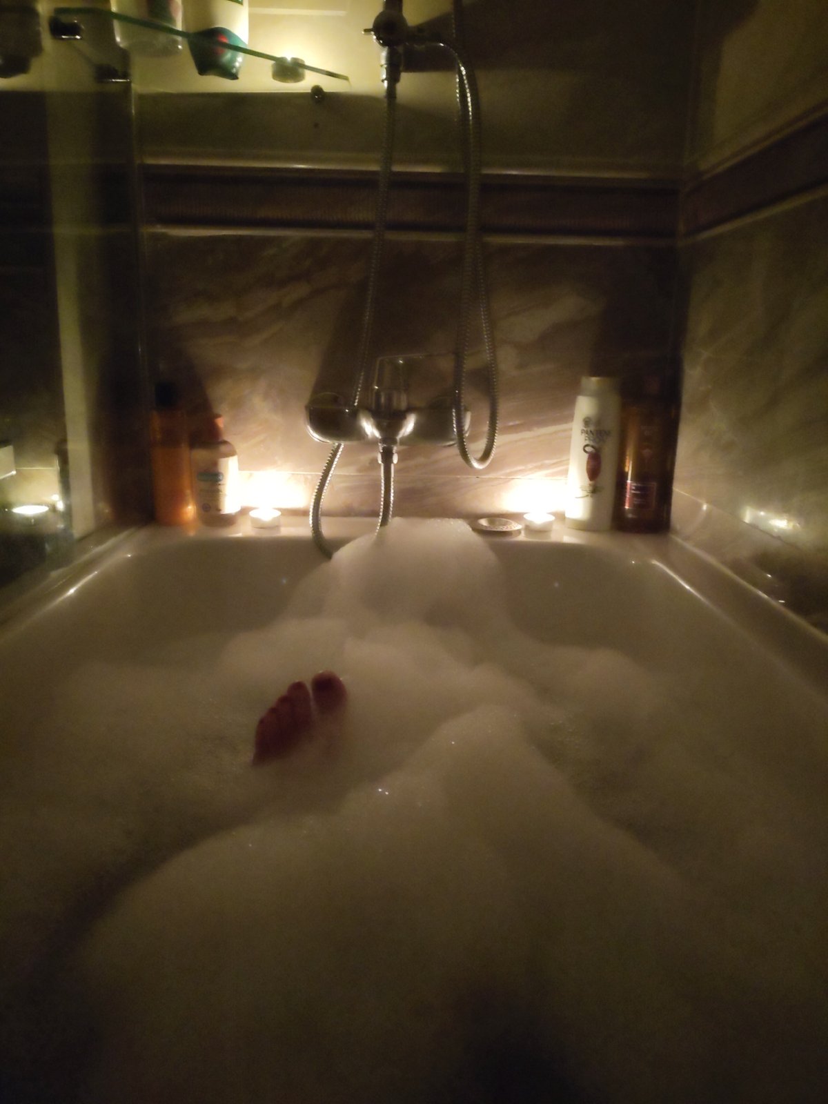 Candlelit bubble bath captured in Vienna home