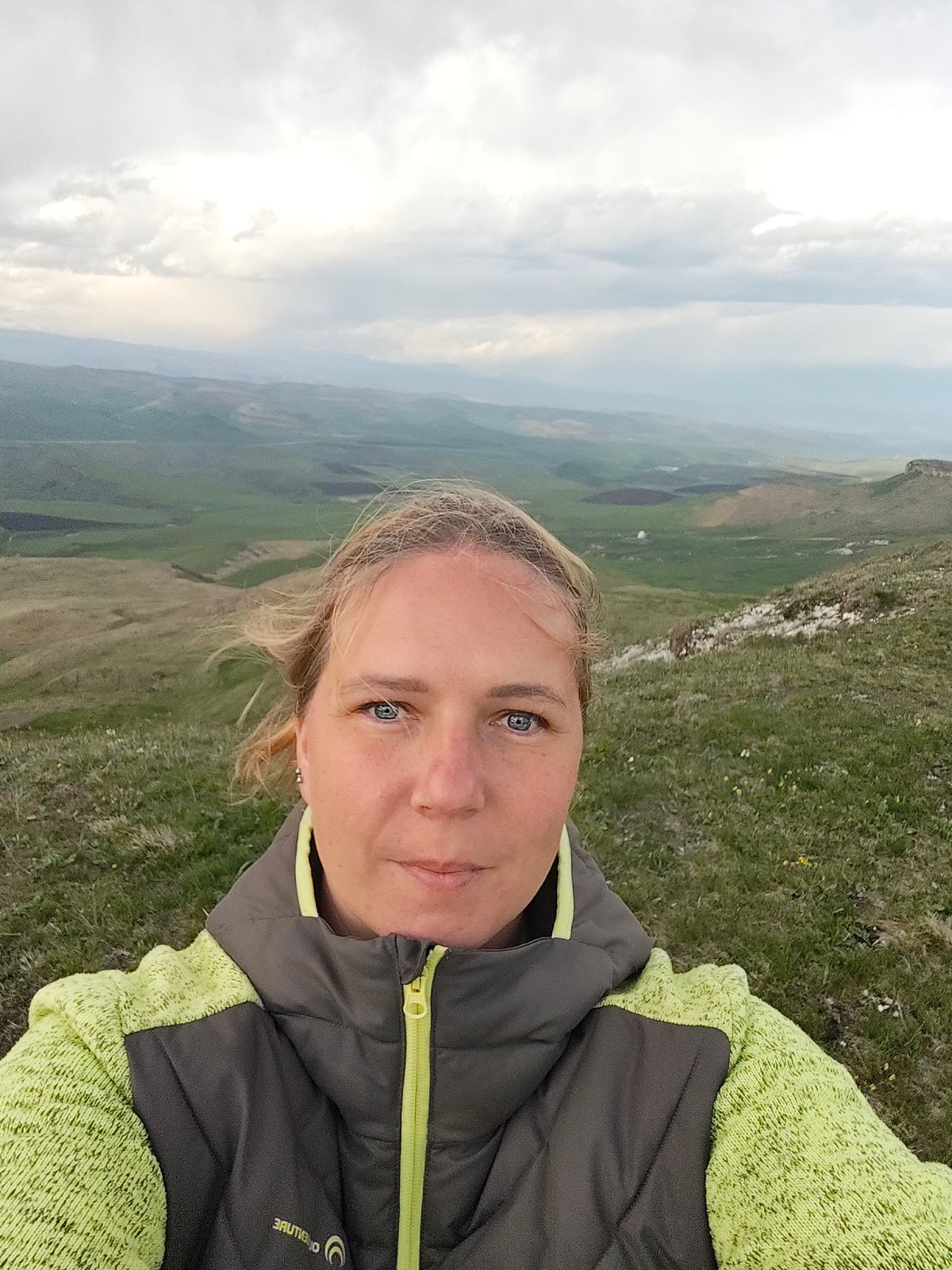 Woman documents camping trip with dog in Russian hills