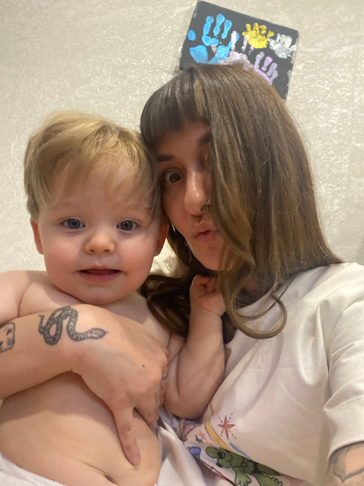 Adult holds toddler in Votkinsk, Russia