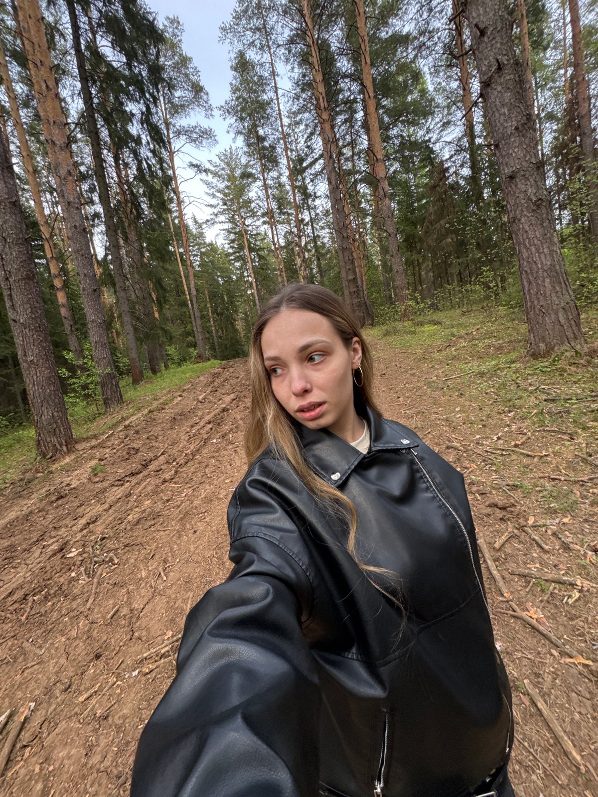 Woman poses for casual photos in Russian forest
