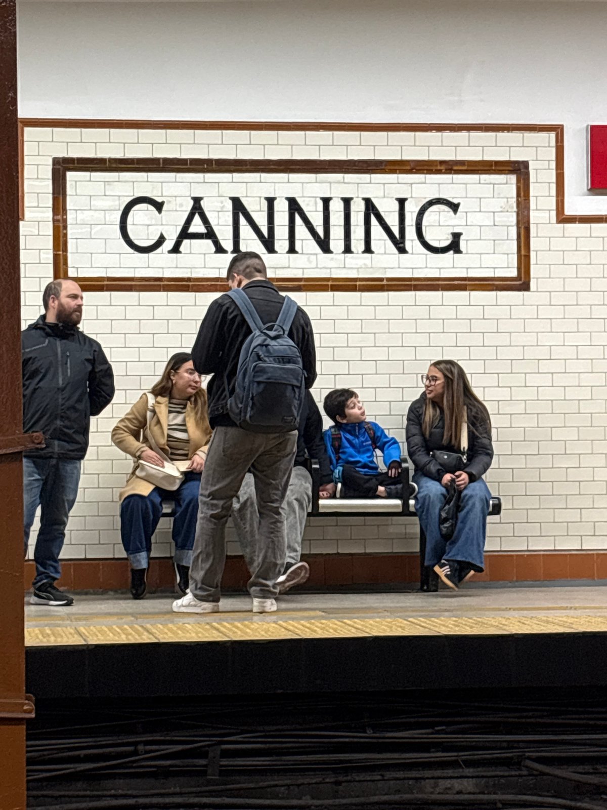 Evening commuters gather at Buenos Aires Canning subway station
