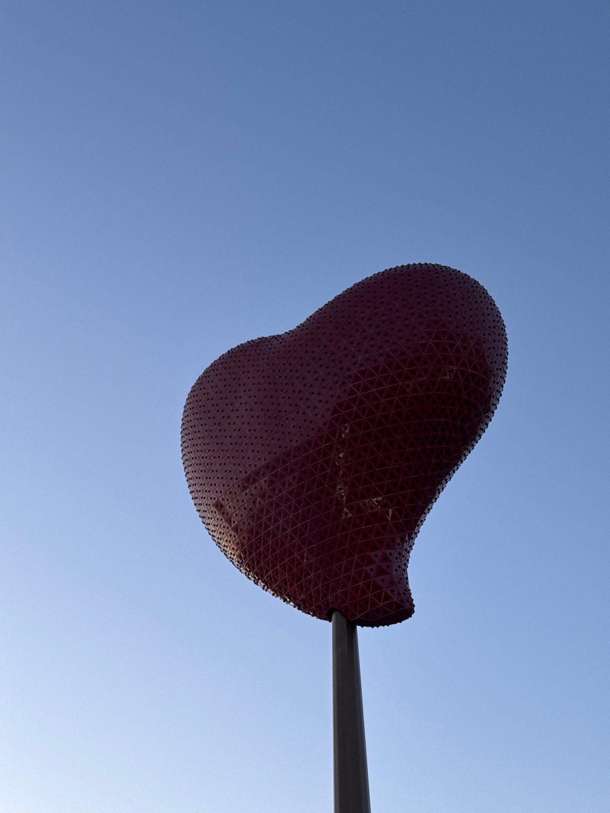 Red heart sculpture spotted on pole in Paris