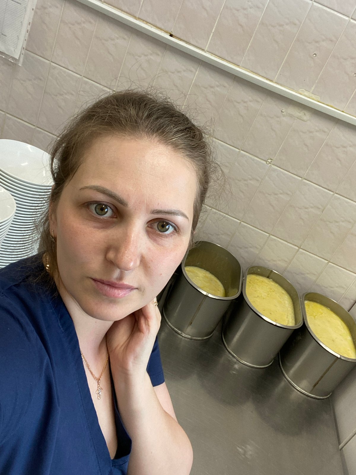 Woman takes selfie near food containers in Марковский, Russia