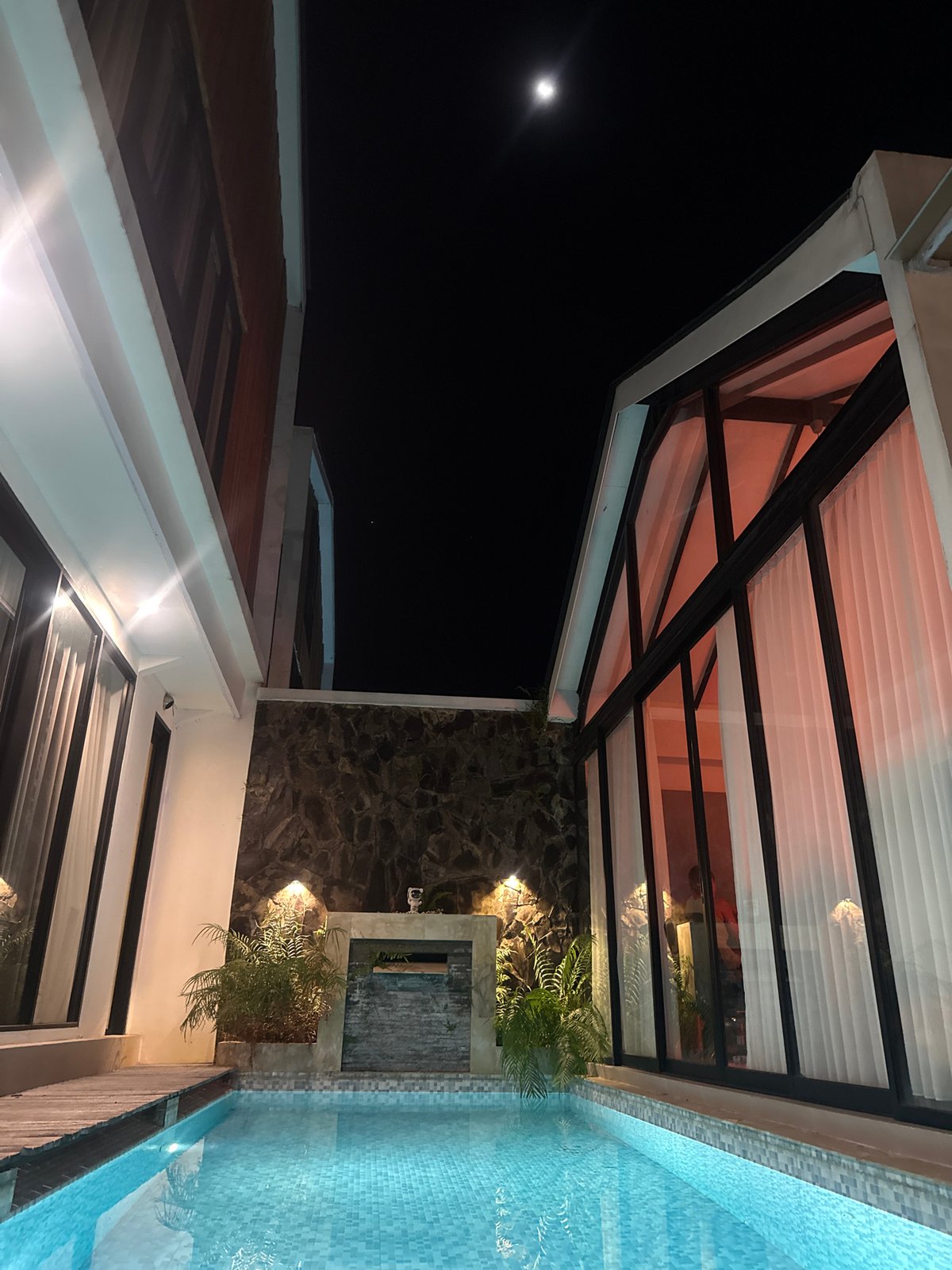 Woman photographed by illuminated pool in Kediri, Indonesia
