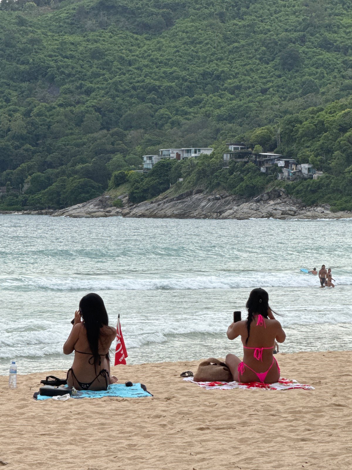 Rawai Beach morning: kitesurfing, sunbathers, and everyday shoreline life