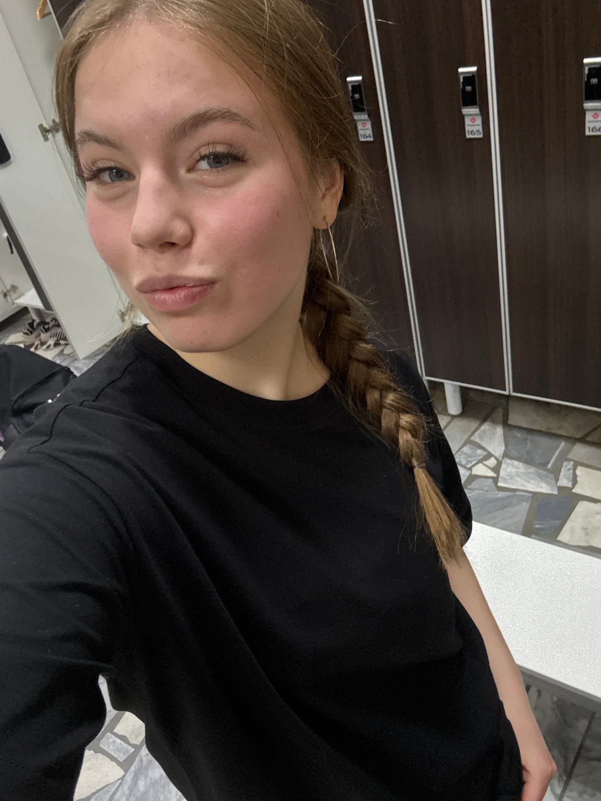 Woman takes mirror selfies in changing room, Chaikovsky