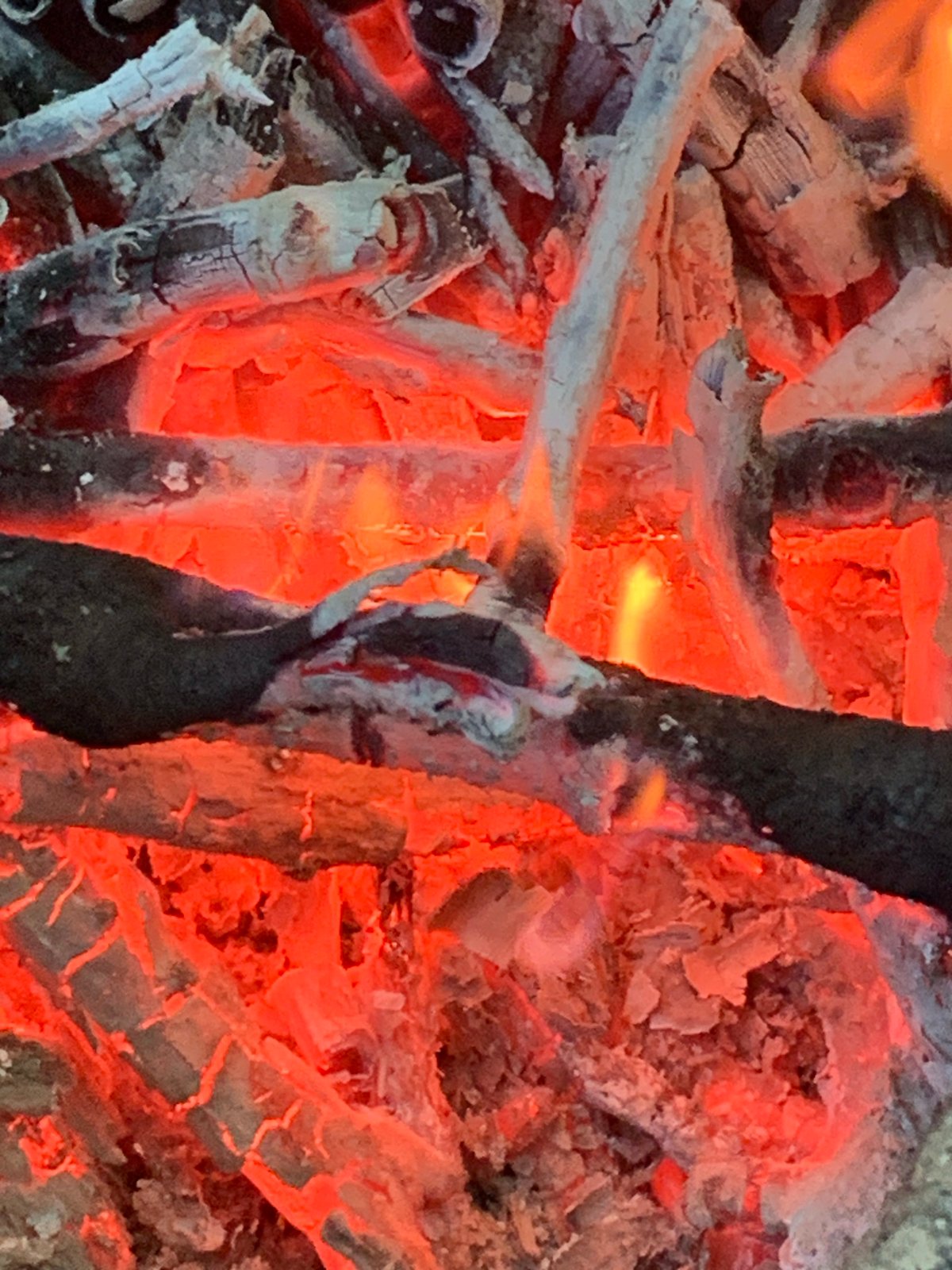 High-temperature fire with wood or charcoal embers documented