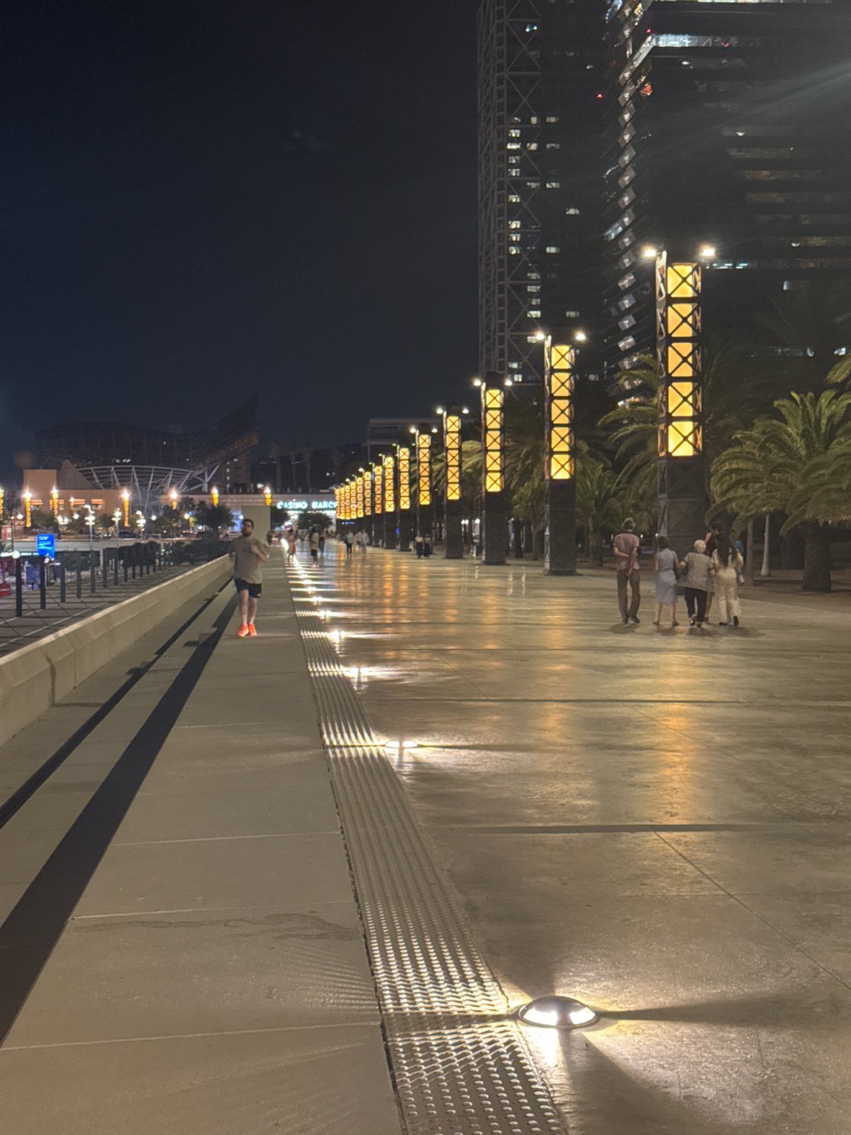 Night stroll along Barcelona's Port Olímpic marina promenade