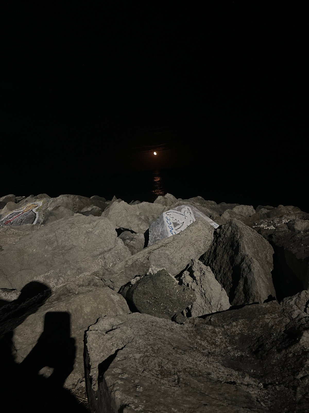 Painted rocks and moonlight along Primorsko's Black Sea shore