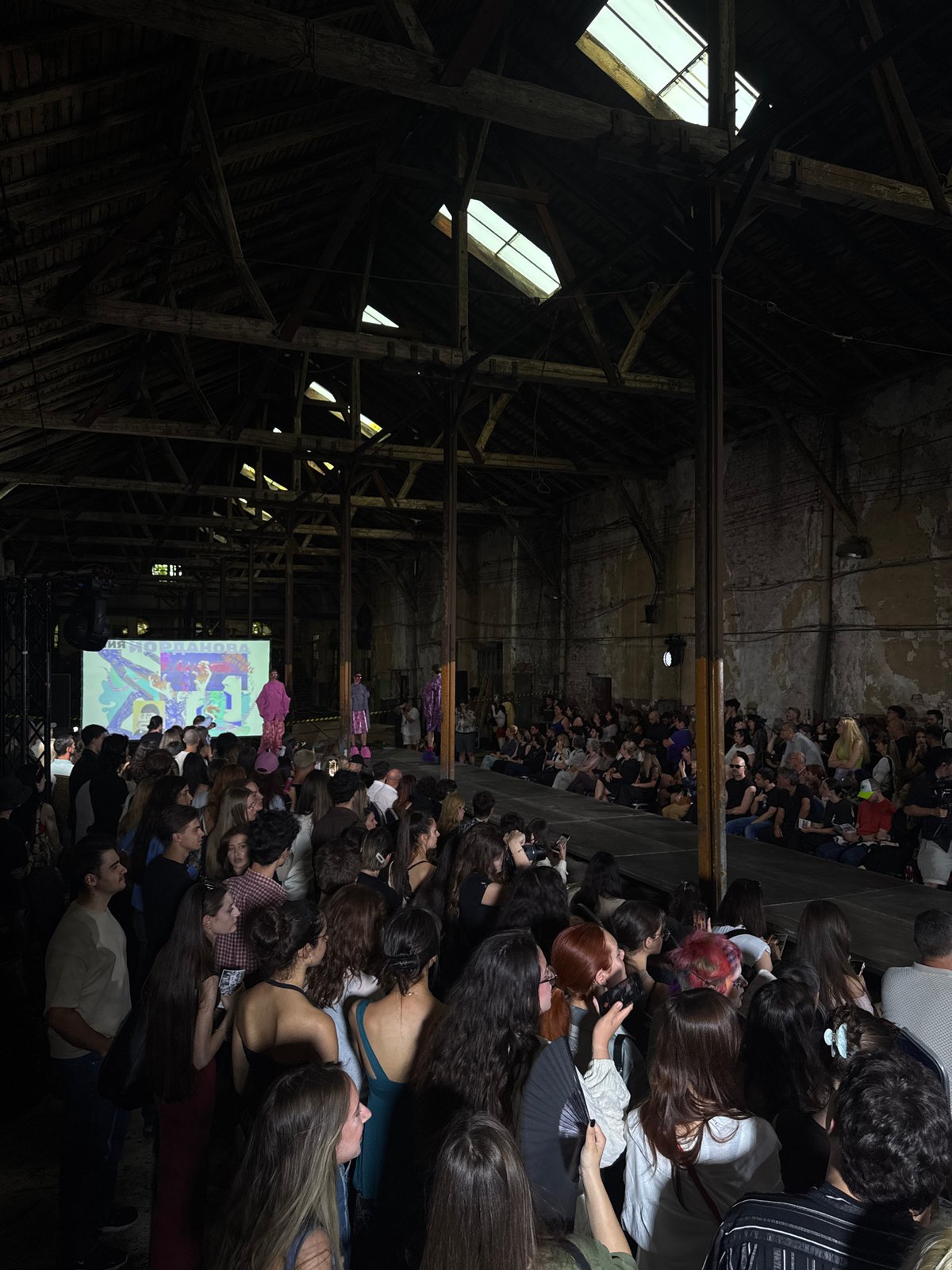 Fashion show held in industrial warehouse venue