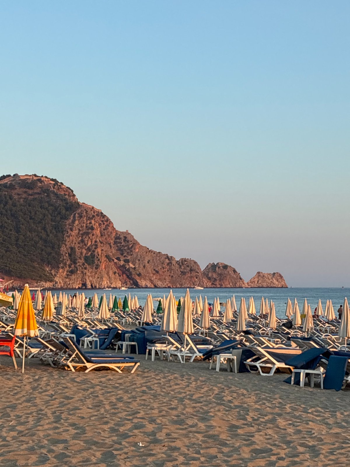 Golden hour on Alanya's beach and promenade, July evening
